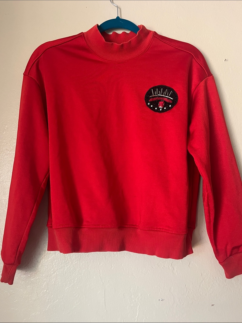 Women's Red Crewneck Sweater with Embroidered Chest Patch